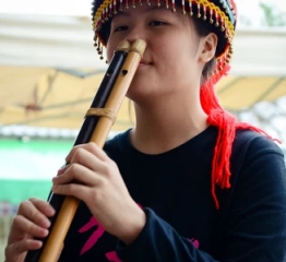 Taiwan woman playing double nose pipes